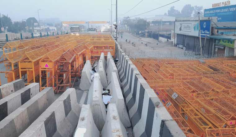Barricades put up at a border leading to Delhi ahead of the farmers' protest march | Josekutty Panackal