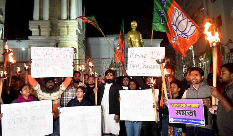 Activists of BJP Yuva Morcha stage a protest against TMC workers who allegedly disrespected the modesty of women in Sandeshkhali, in Kolkata | PTI