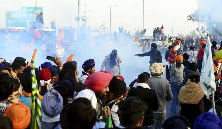 Police fire tear gas to disperse farmers during their 'Delhi Chalo' march, near the Punjab-Haryana Shambhu border | PTI