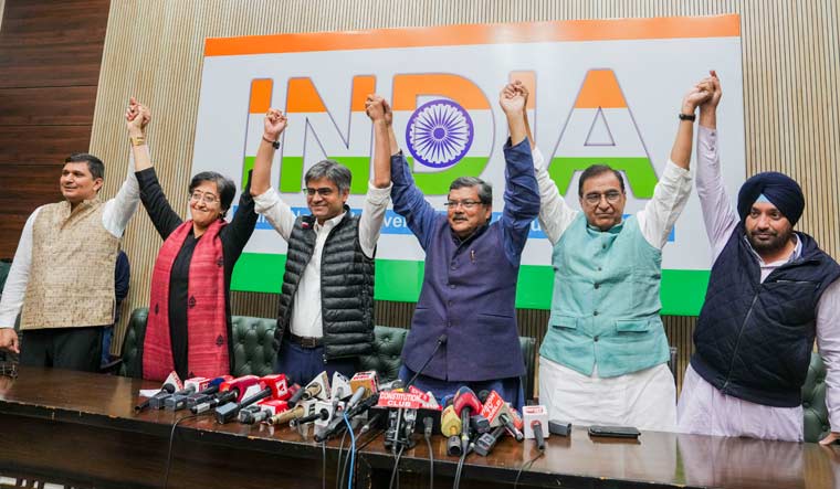 AAP leaders Saurabh Bharadwaj, Atishi Singh and Sandeep Pathak with Congress leaders Mukul Wasnik, Deepak Babaria and Arvinder Singh Lovely during a joint press conference, in New Delhi | PTI
