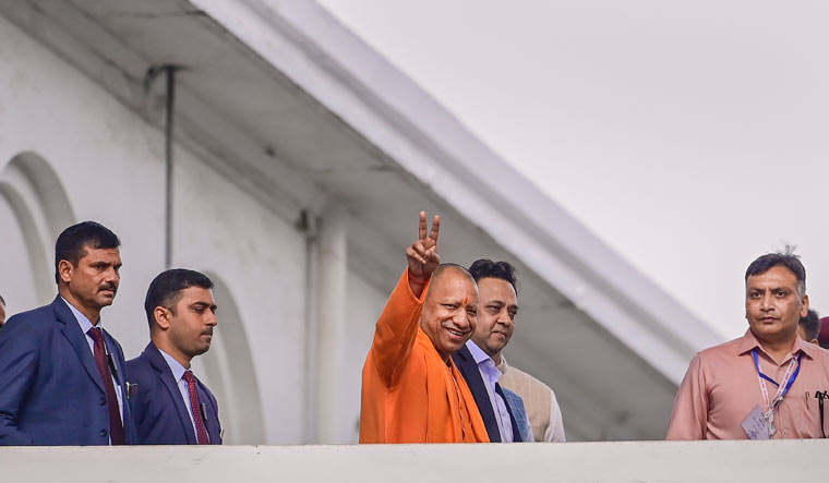 Uttar Pradesh Chief Minister Yogi Adityanath leaves after casting his vote for the Rajya Sabha elections, in Lucknow | PTI