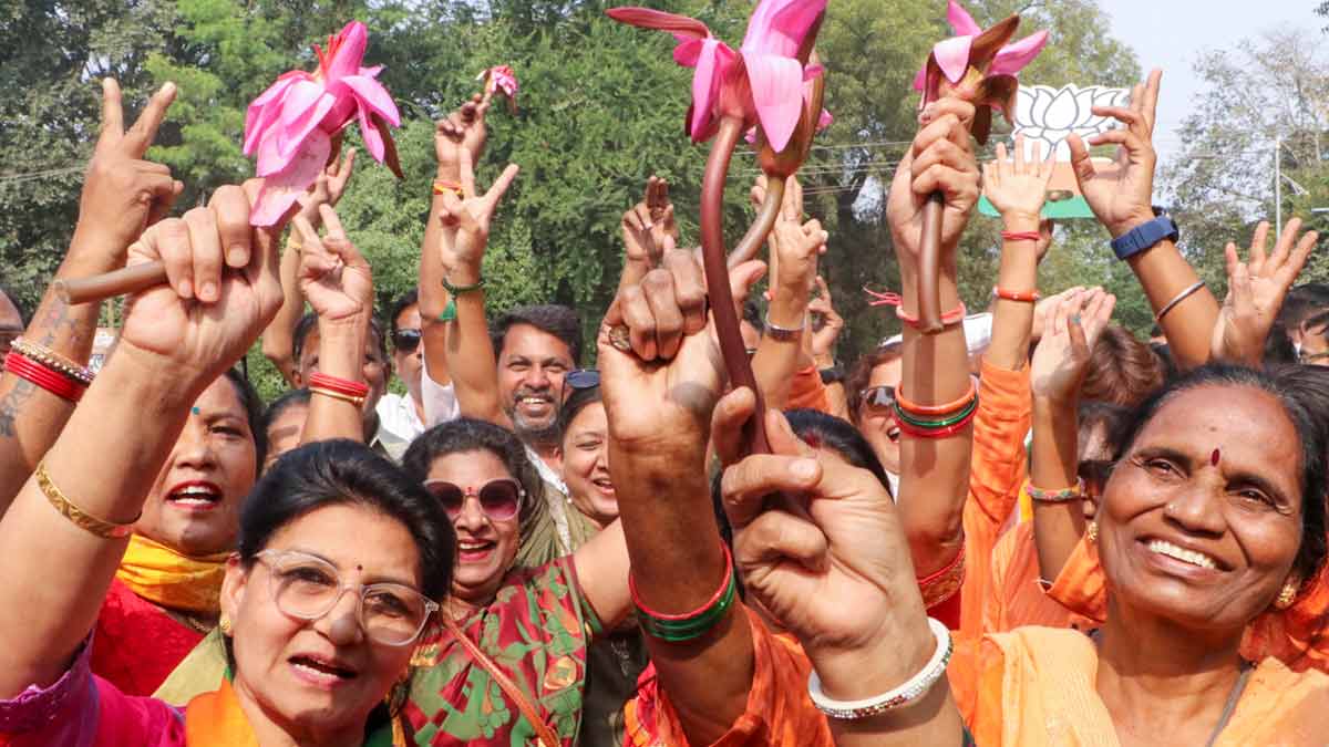 BJP women workers hold lotus while celebrating NDA's win Maharashtra Assembly elections, in Nagpur | PTI