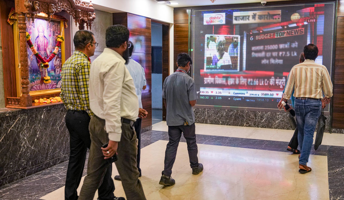 People look at the screen at the Bombay Stock Exchange during the presentation of Union Budget 2024-25 by Finance Minister Nirmala Sitharaman | PTI