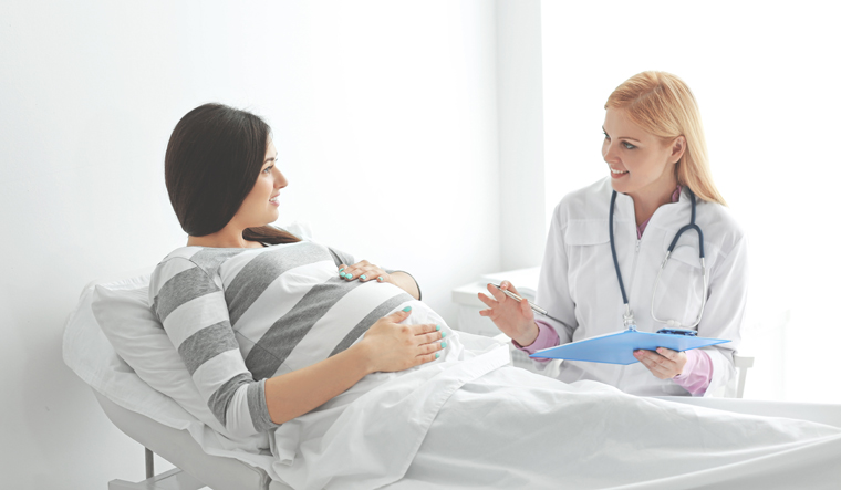 pregnancy-pregnant-woman-bed-doctor-medical-shut