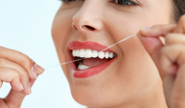 dental-floss-teeth-cleaning-oral-health