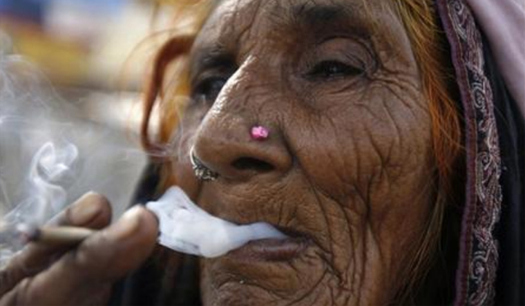 smoking-bidi-smoker-old-woman-reu