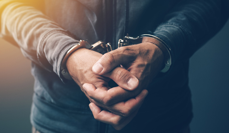 hand-cuffed-man-handcuffed-arrested-police-crime-shut