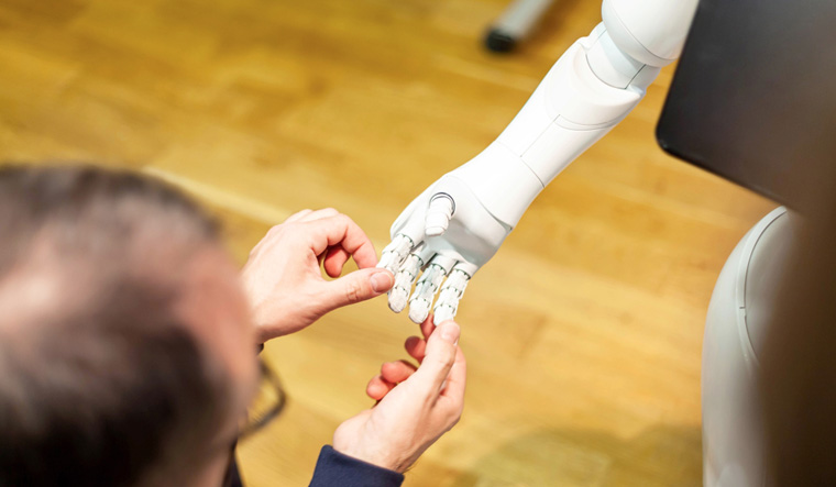 man-gently-holding-hand-of-humanoid-robot-assistant-shut