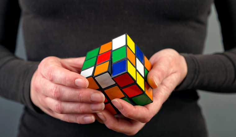 Woman-solving-Rubiks-Cube-puzzle-Rubik