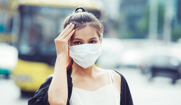 air-pollution-woman-mask-walking-shut