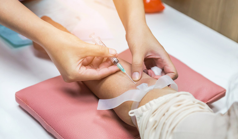 blood-test-sample-nurse-pricking-needle-lab-test-medical-syringe-arm-shut