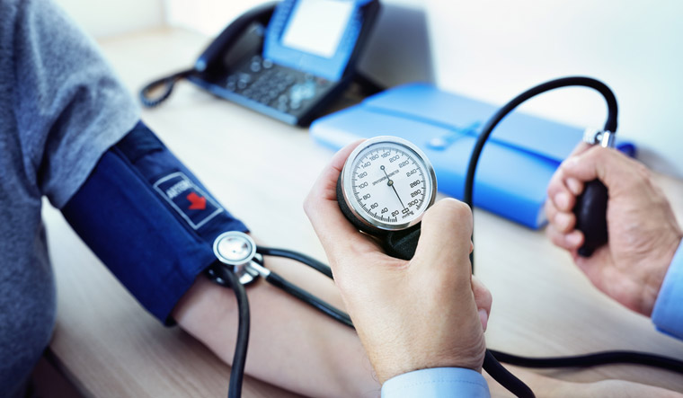 hypertension-blood-pressure-woman-doctor-patient-shut