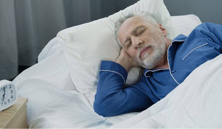 retired-old-man-sleeping-bed-morning-clock-shut
