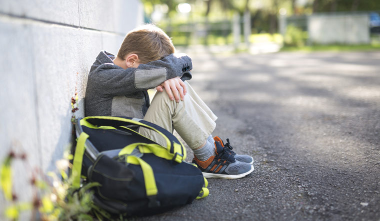 school-boy-bullied-bullying-teasing-child-schoolbag-sad-shut