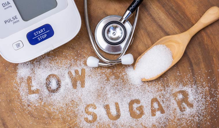 White-sugar-in-wooden-scoop-low-calorie-sugar-low-sugar-health-shut