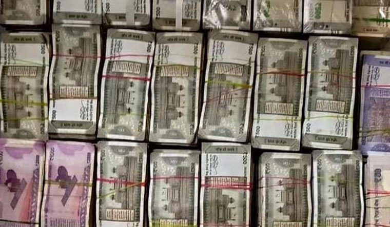 cash-bundles-rupee-seized-bank