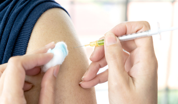 close-up-hand-of-Doctor-giving-patient-taking-vaccine-flu-or-influenza-shot-shut