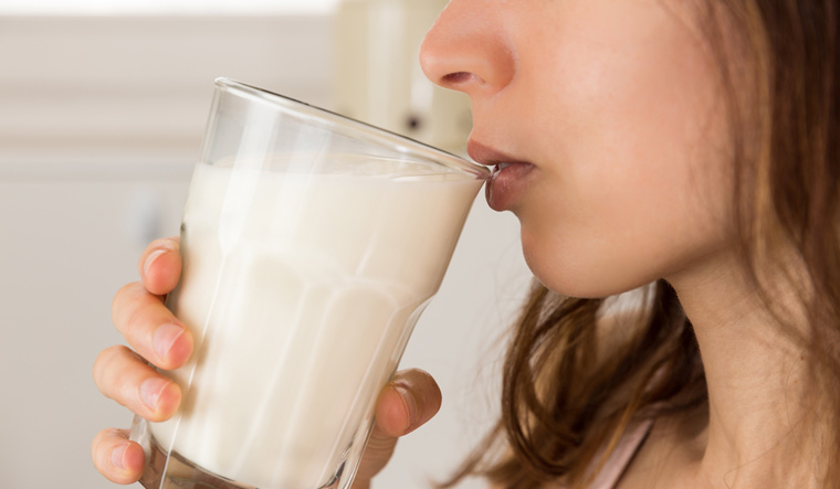 dairy-milk-woman-drinking-milk-glass-shut
