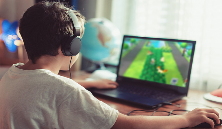 gamer-boy-playing-on-laptop-at-home-computer-shut