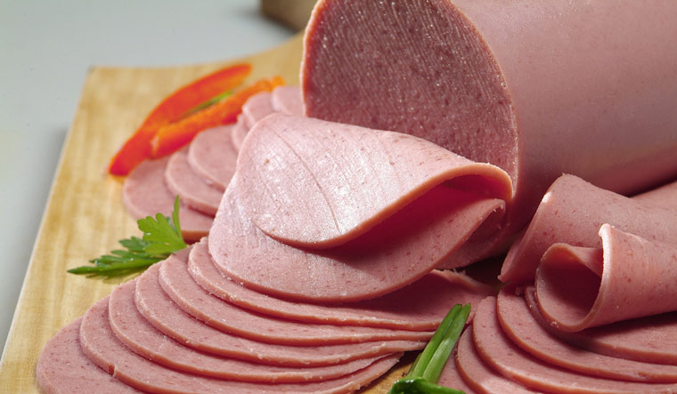 meat-sliced-bologna-decorated-with-vegetables-shut
