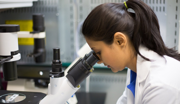 woman-scientist-science-lab-microscope-shut