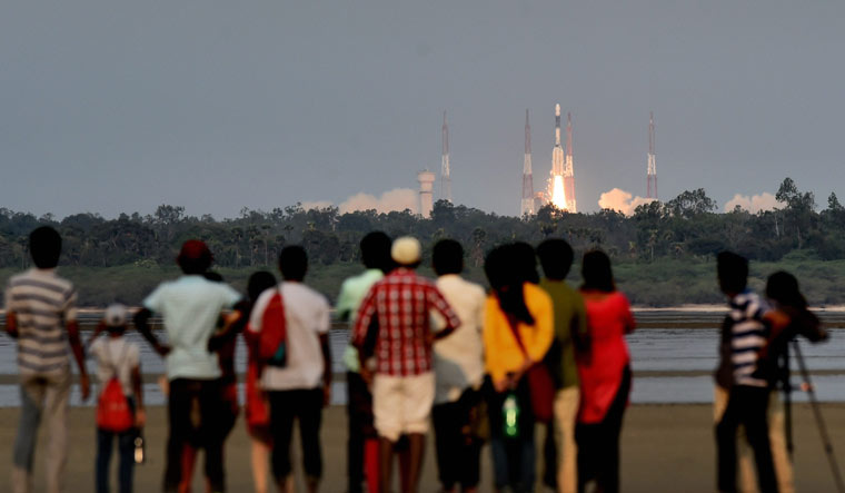 People look on as ISRO's GSLV-F08 carrying GSAT-6A communication satellite blasts off into the orbit from Satish Dhawan Space Centre in Sriharikota on March 29 | PTI