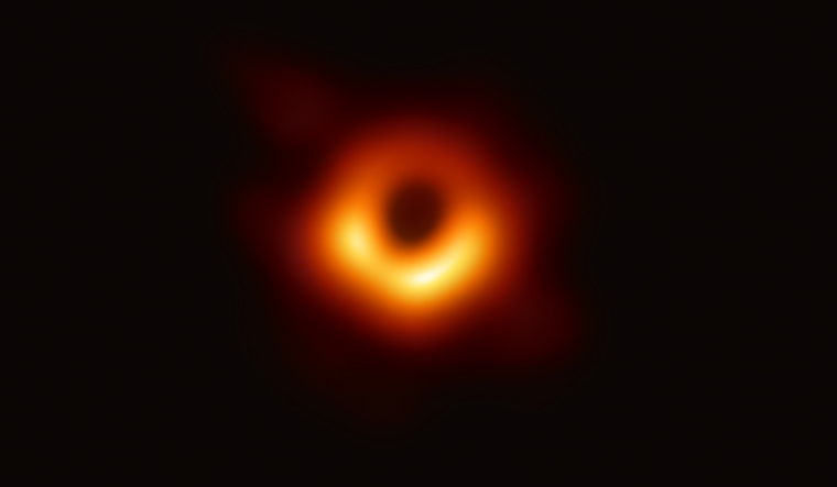 Scientists reveal first-ever image of black hole