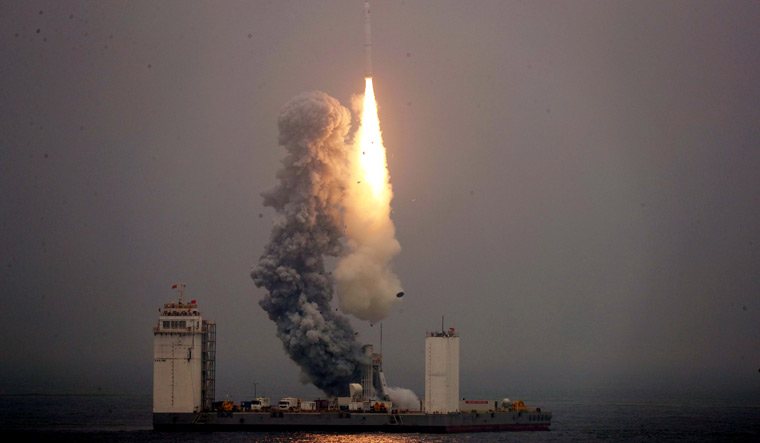 China launches its first rocket from mobile platform in sea