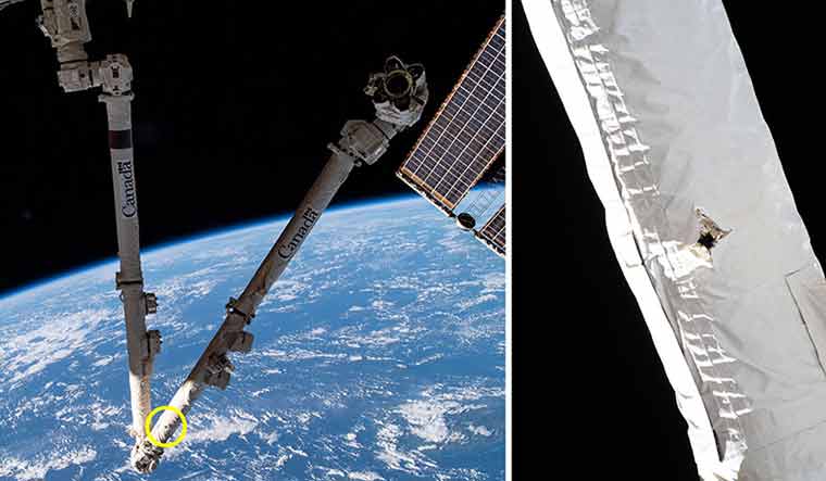 canadarm-orbital-debris-hole-ISS