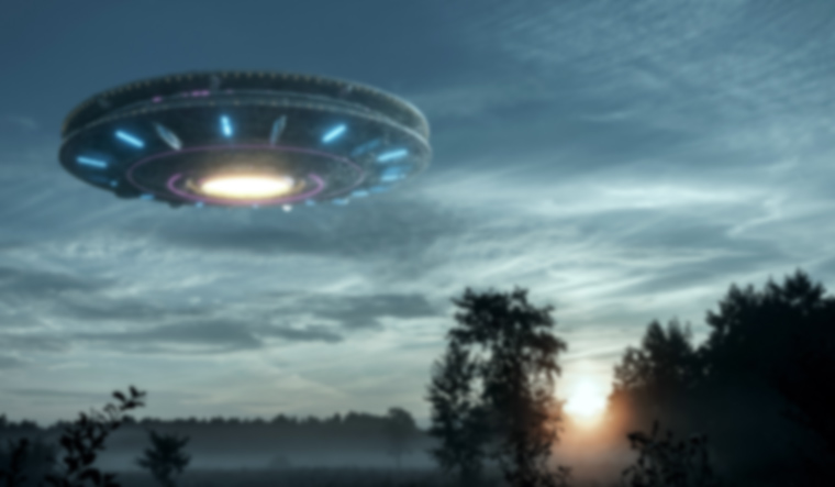 UFO-alien-plate-hovering-over-the-field-Unidentified-flying-object-alien-invasion-extraterrestrial-life-shut