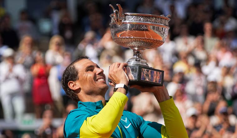 Rafael Nadal holds the trophy after winning the French Open title | AP