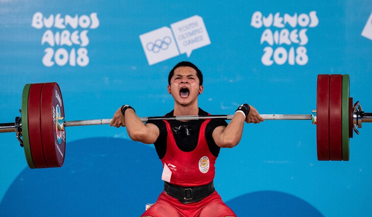 Jeremy Lalrinnunga competes in the men's weightlifting 62kg category | AP