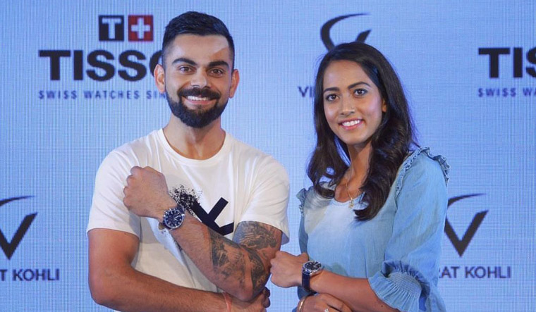 Twitter ridicules Kohli for trying to match Karman Kaur's height