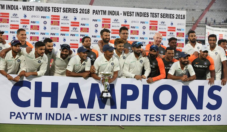 Team India poses for with the trophy after winning the India-West Indies Test series | AP
