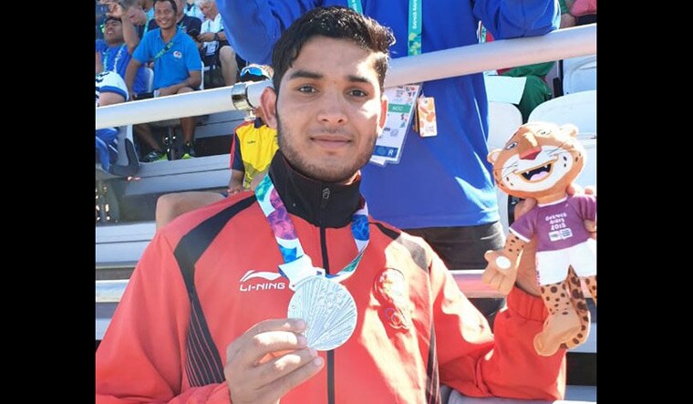 Suraj Panwar poses with his silver medal | Indian Olympic Association via Twitter 