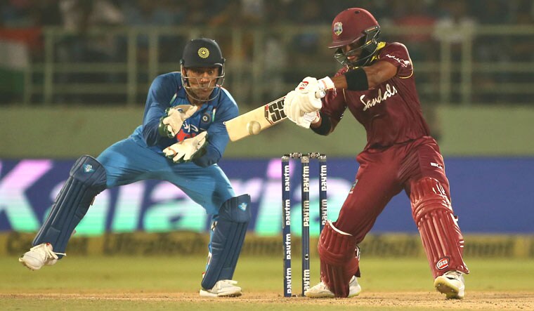 Shai Hope plays a shot as wicketkeeper Mahendra Singh Dhoni looks on during the second ODI match between India and West Indies in Visakhapatnam | AP