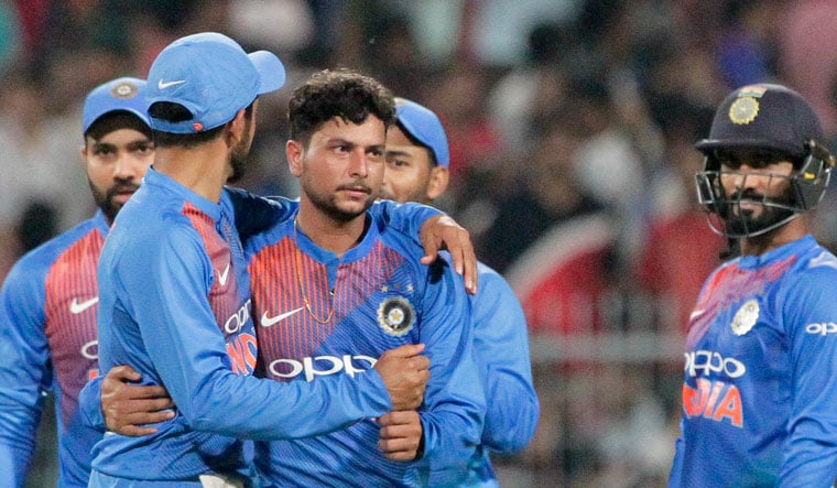 India's Kuldeep Yadav (center) celebrates with teammates the dismissal of West Indies' captain Carlos Brathwaite | AP