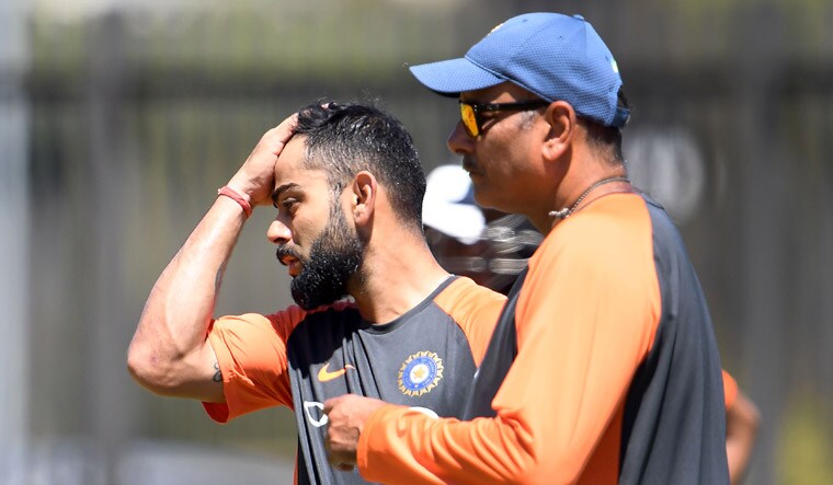 India captain Virat Kohli (left) and coach Ravi Shastri attend a training session in Perth, ahead of the second Test match against Australia | AFP