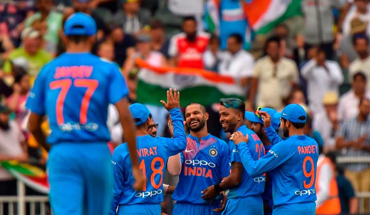 Indian players celebrate dismissal of South African batsman David Miller | AFP