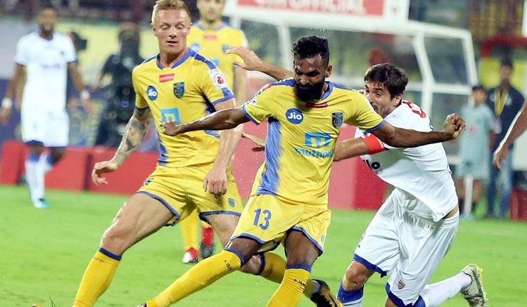  Players of Kerala Blasters FC ( Yellow Jersey) and Chennaiyin FC in action | PTI