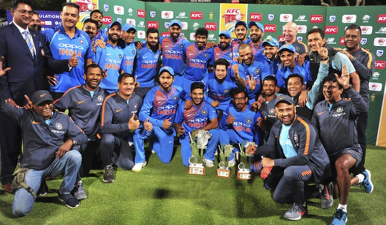 The Indian cricket team pose for a photo with their trophy after beating South Africa in the third and final T20 cricket match | AP