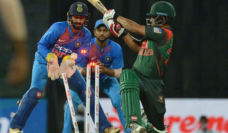 Bangladesh batsman Tamim Iqbal is dismissed by Washington Sundar (unseen) during the fifth Twenty20 (T20) match of the tri-nation Nidahas Trophy at the R. Premadasa stadium in Colombo | AFP