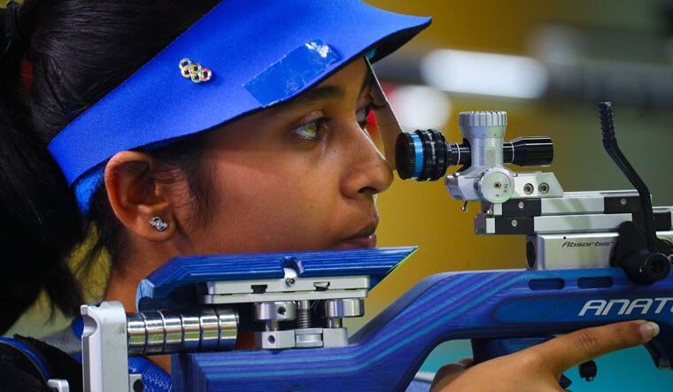 Mehuli Ghosh takes aim during the women's 10m air rifle shooting final at the 2018 Commonwealth Games at the Belmont Shooting Complex in Brisbane | AFP
