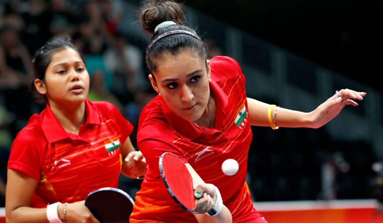 Mouma Das and Manika Batra in action against Singapore in women's doubles in TT at the Commonwealth Games | Reuters