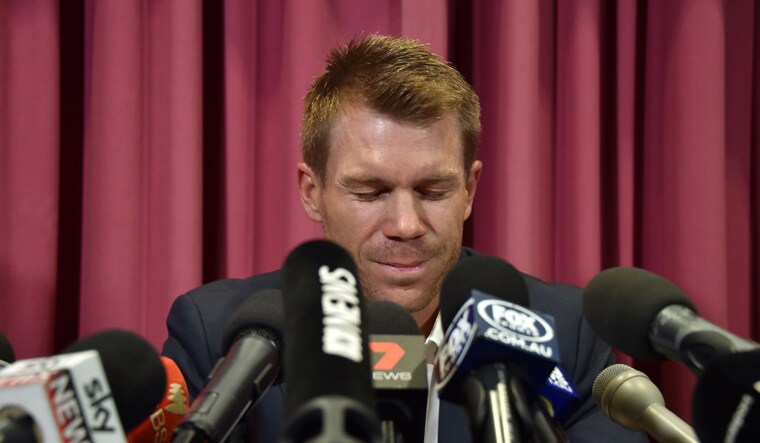 David Warner was handed a one-year ban by Cricket Australia for his role in the ball-tampering incident | AFP