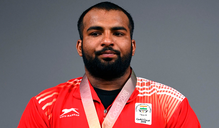 Weightlifter Pardeep claims silver in 105kg final