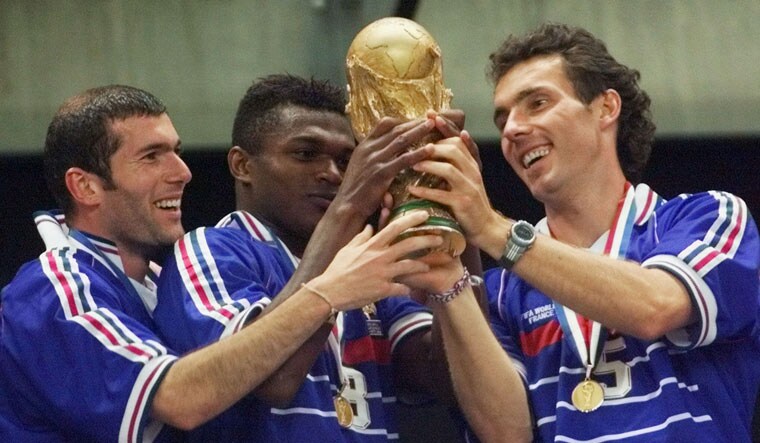 (File) French players (from left) Zinedine Zidane, Marcel Desailly and Laurent Blanc hold the 1998 World Cup after France defeated Brazil 3-0 in the World Cup final match, at the Stade de France in Saint Denis | AP