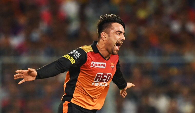 Sunrisers Hyderabad's Rashid Khan celebrates after taking the wicket of Kolkata Knight Riders cricketer Andre Russell during Qualifier 2 | AFP