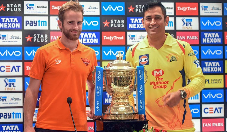 Sunrisers Hyderabad captain Kane Williamson and Chennai Super Kings captain Mahendra Singh Dhoni poses with VIVO IPL cricket T20 trophy during a press conference in Mumbai on Saturday | PTI