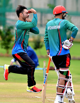Rashid Khan (left) trains with his team | AFP